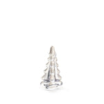 A small silver figurine from the Snowy Branches Evergreen Tree Collection by Simon Pearce is centered against a plain white background, evoking Vermont’s winter woods.