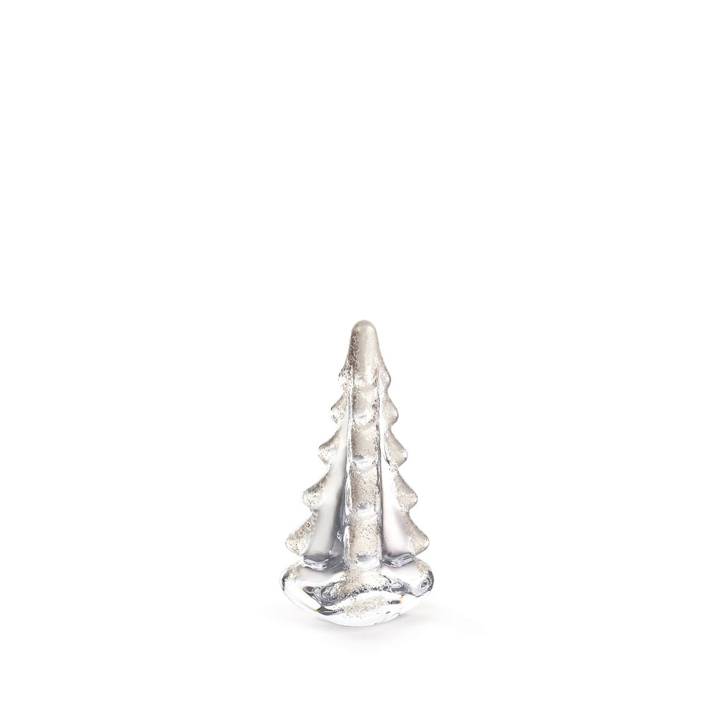 A small silver figurine from the Snowy Branches Evergreen Tree Collection by Simon Pearce is centered against a plain white background, evoking Vermont’s winter woods.