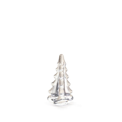 A small silver figurine from the Snowy Branches Evergreen Tree Collection by Simon Pearce is centered against a plain white background, evoking Vermont’s winter woods.