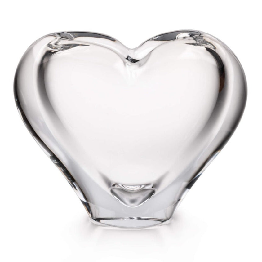 The Romance Large Vase by Simon Pearce is a heart-shaped glass sculpture, skillfully handmade through glassblowing techniques and showcased against a simple white background.
