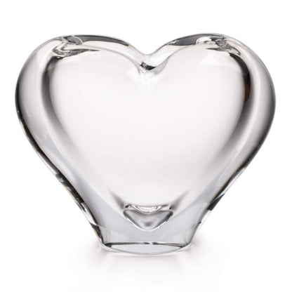 The Romance Large Vase by Simon Pearce is a heart-shaped glass sculpture, skillfully handmade through glassblowing techniques and showcased against a simple white background.