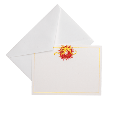 A blank white card from Caspari’s Pepperberry Tabletop and Stationery Collection features a gold and red design with a gold border, nestled in a white envelope—ideal for pairing with elegant guest towel napkins at any event.