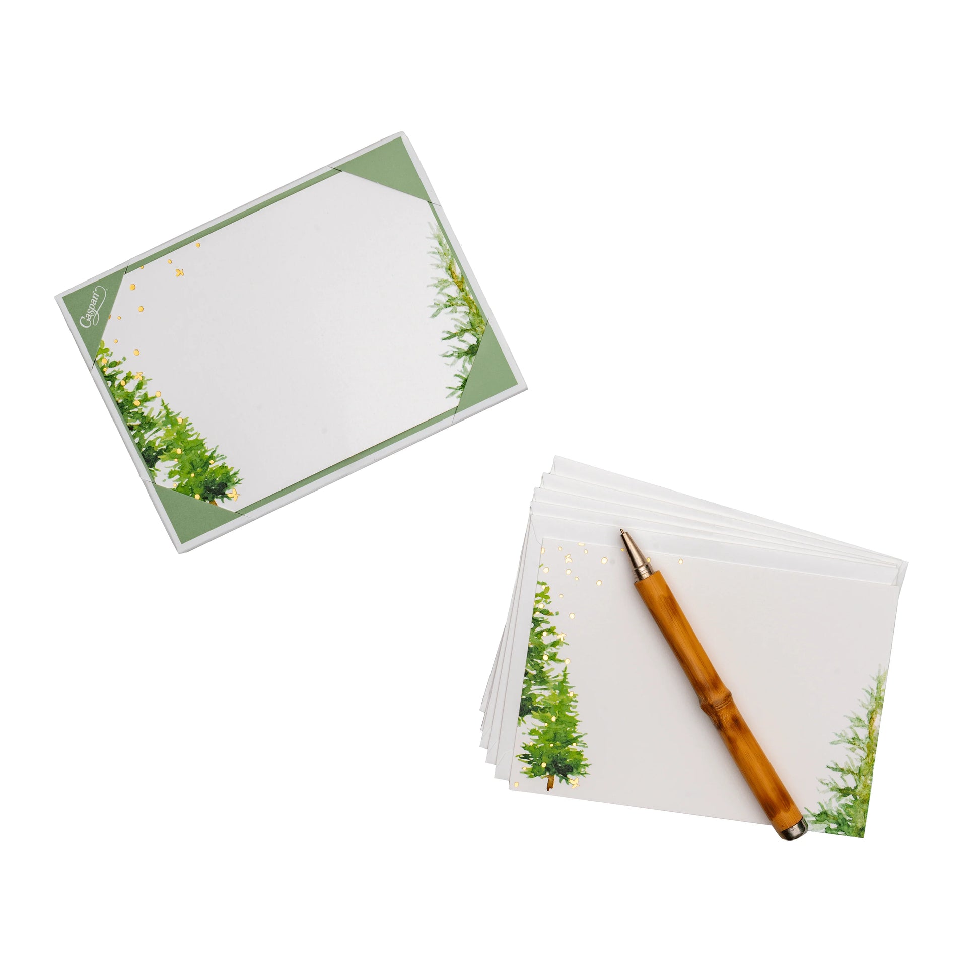 A set of Caspari White Christmas Foil Correspondence Cards is shown on a white background with a brown pen—ideal for elegant holiday party supplies or festive paper tableware needs.