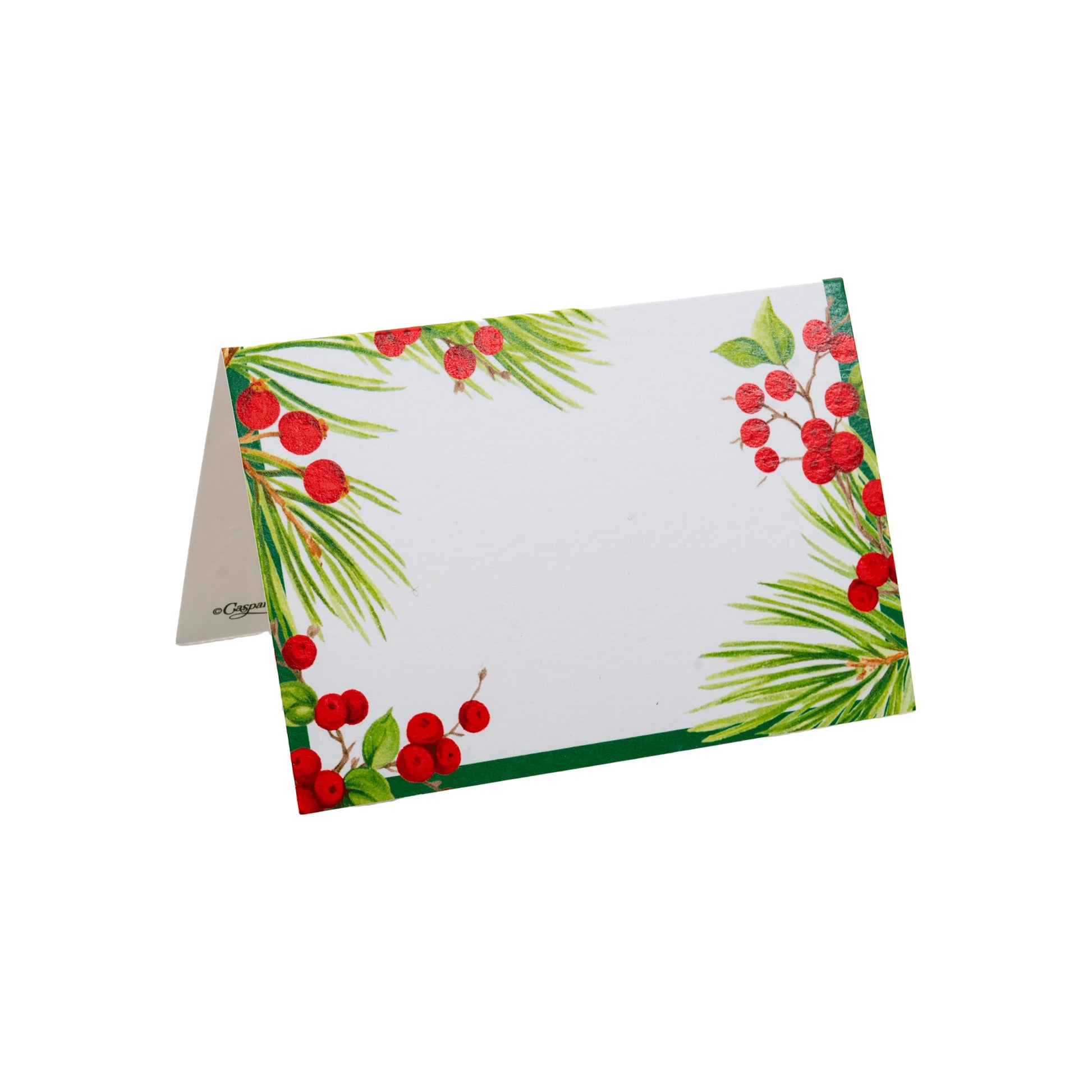 The Caspari Evergreen and Berries White Collection blank folded card features green pine needles and red berries on white, ideal for pairing with matching festive paper plates or other dinnerware.