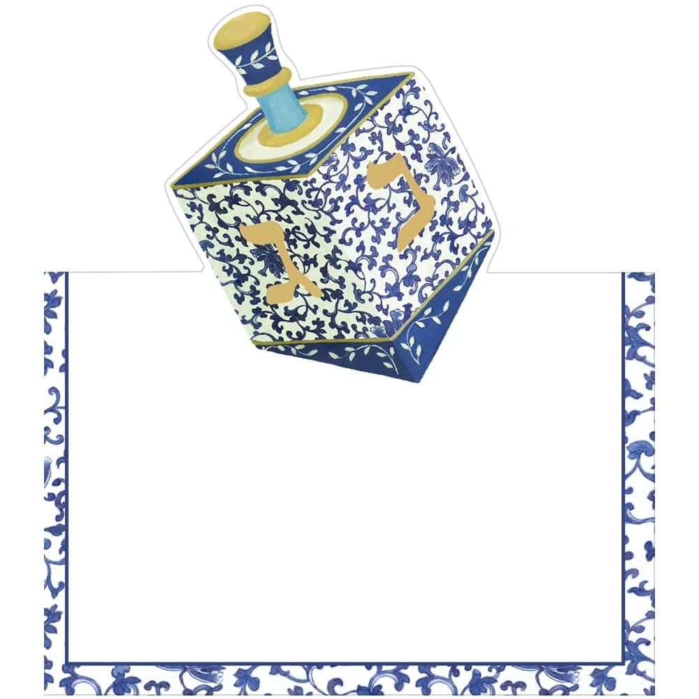 From the Patterned Dreidel Collection by Caspari, a blue and white dreidel featuring gold Hebrew letters appears above a blank bordered area adorned with a coordinating blue floral motif—an ideal choice for Hanukkah greetings or festive holiday gifts.
