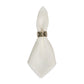 The Berry Scallop Napkin Set by Juliska features white woven linen napkins, each secured with a decorative metal ring, displayed against a plain white background.