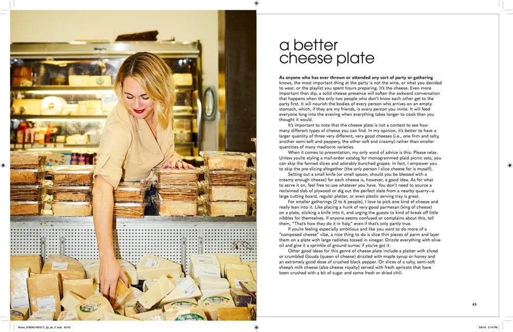 Person selecting "Nothing Fancy: The Art of Having People Over" by Common Ground from a display in a store, accompanied by text titled "A Better Cheese Plate" discussing tips for creating an impressive cheese platter for gatherings and visually stunning recipes.