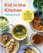 Cover of “Kid in the Kitchen” from Penguin Random House, highlighting tacos, guacamole, lettuce, shredded meat, salsa, and chopped herbs in bowls alongside a badge reading “100 Recipes & Tips for Young Home Cooks.” Explore easy and inspiring recipes designed especially for young chefs.