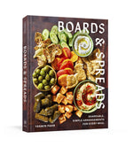 “Boards & Spreads” by Penguin Random House is a cookbook that showcases an array of vegetables, dips, and snacks artistically presented on a wooden board—an ideal source of inspiration for creating your own appetizer spreads and inventive recipe boards.