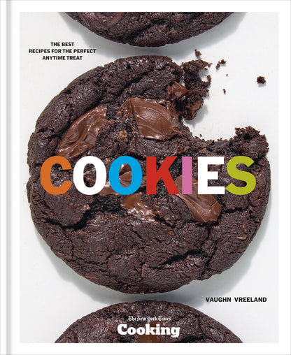 Close-up of three Penguin Random House Cookies on a white background, one with a bite taken out, with the word “COOKIES” in colorful text across the center—a mouthwatering dessert moment inspired by NYT Cooking.