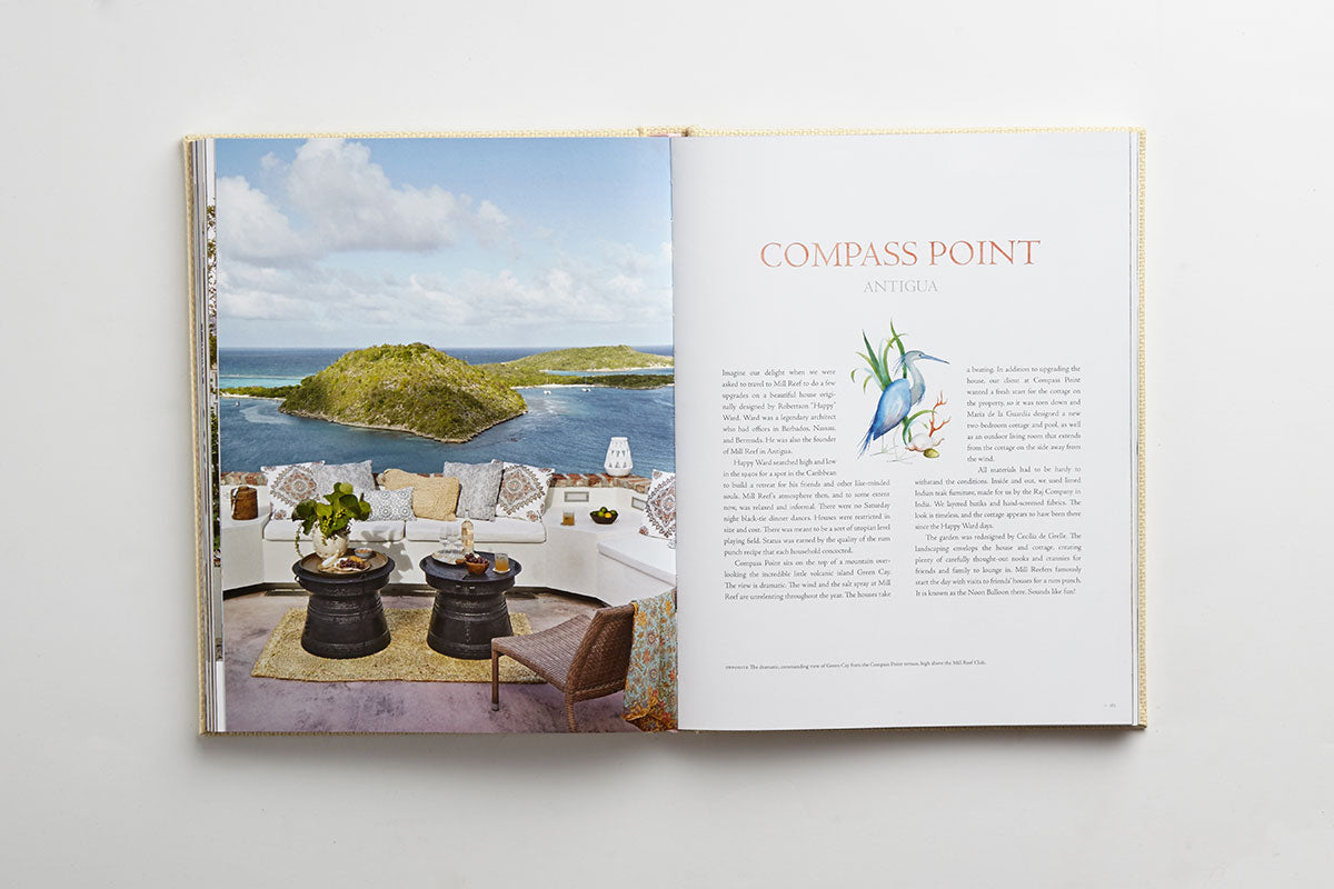Open book displaying a seaside terrace overlooking the ocean and islands on the left page, evoking island lifestyle, with the title “Island Hopping” by Common Ground, accompanied by text and an illustration on the right page.