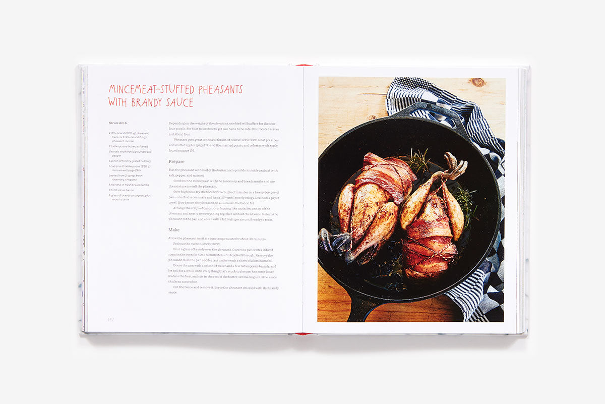 A Home Made Christmas cookbook spread featuring a recipe for mincemeat-stuffed pheasants with brandy sauce, accompanied by a photo of two bacon-wrapped pheasants in a cast-iron skillet.