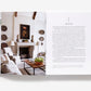 Open book of Atmosphere: The Seven Elements of Great Design, showing a neutral-toned living room photo on the left page and a chapter titled “Style” on the right.