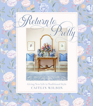 The “Return To Pretty” book cover by Abrams features a floral background and a beautifully styled room with blue chairs, floral arrangements, and decorative accents, perfectly embodying Grandmillennial style and timeless home decor.