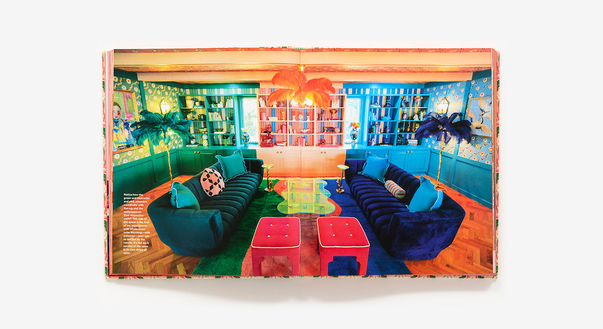 The Maximalist: Colorful Interiors for Bold Living by Abrams showcases vibrant living rooms with blue sofas, bright decor, wall shelves, and bold lighting—perfect for fans of maximalist design.