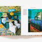 An open book of "The Maximalist: Colorful Interiors for Bold Living" by Abrams showcases a vibrant blue bedroom with patterned walls, ceiling, and carpet, ornate lighting, white chairs, and colorful home decor.