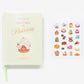 A pale green book, "The Little Book of Ladurée: Patisserie" by Abrams, rests beside a sheet of illustrated Parisian dessert stickers on a white background.