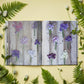 The book “A Year in Flowers” by Chronicle Books is opened to pages showcasing labeled photographs of diverse flowers arranged on rustic wooden backgrounds, with ferns and delicate white blossoms scattered on a yellow surface—providing creative inspiration for seasonal floral arrangements and bouquet design.