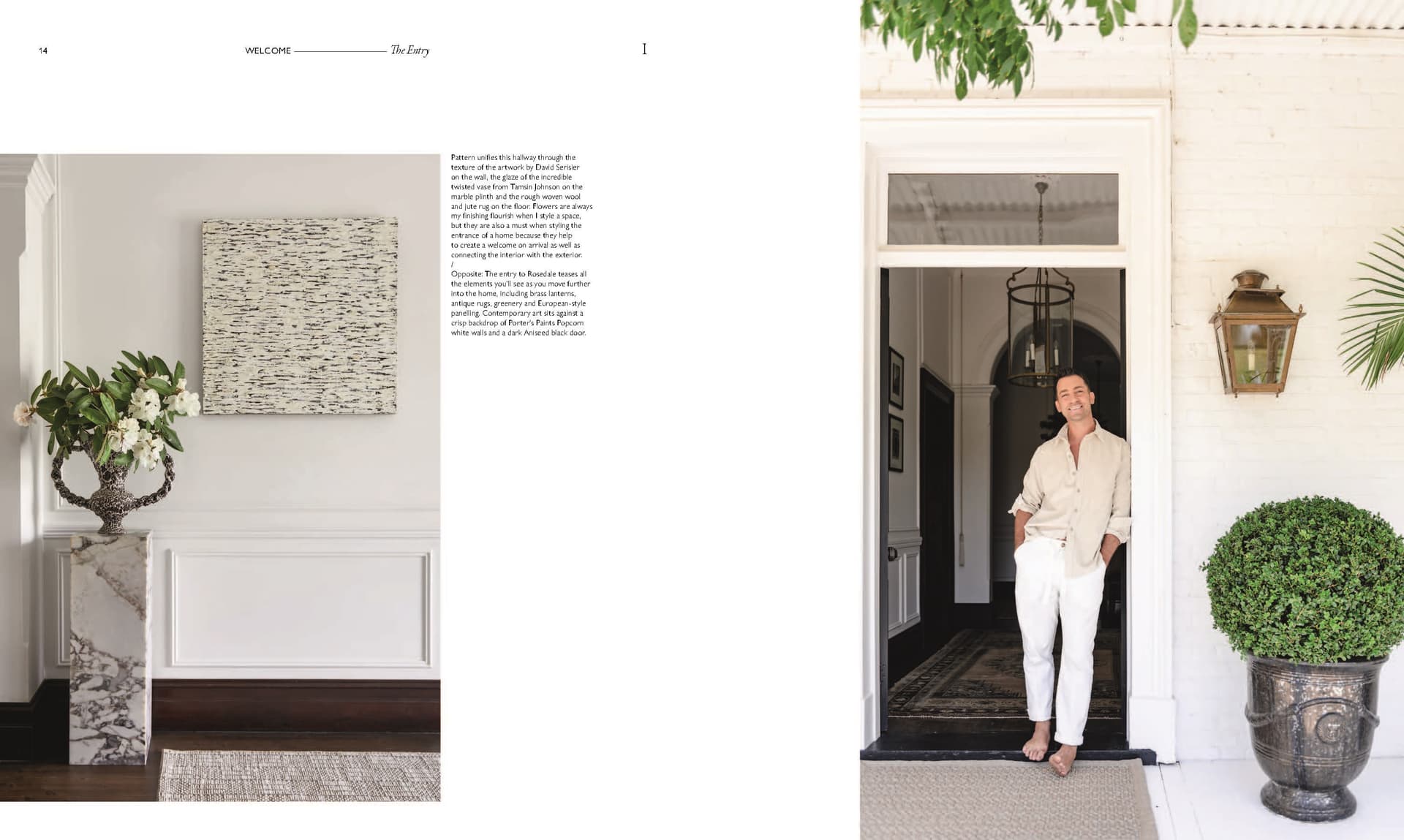 A man stands barefoot in a white doorway, leaning against the frame—a scene that captures the essence of refined home styling found in *Moments At Home* by Chronicle Books. Adjacent is a white room adorned with a vase of flowers and abstract art on the wall, evoking the sophisticated touch of interior design showcased throughout this collection.