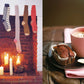 Indulge in a cozy fireside feast with "Comfort: A Winter Cookbook" by Common Ground: a fireplace adorned with stockings and candles bathes the room in a warm glow, setting the scene next to a table that features two chocolate muffins and steaming cups of hot drinks—perfect for savoring the comfort of the season.
