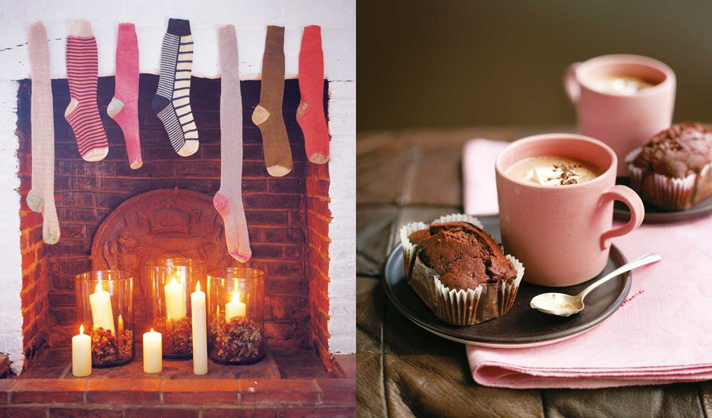 Indulge in a cozy fireside feast with "Comfort: A Winter Cookbook" by Common Ground: a fireplace adorned with stockings and candles bathes the room in a warm glow, setting the scene next to a table that features two chocolate muffins and steaming cups of hot drinks—perfect for savoring the comfort of the season.