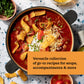 A bowl of chili topped with sour cream, shredded cheese, chives, and corn chips sits beside a garnish of chopped parsley, accompanied by text about Every Season Is Soup Season—a soup cookbook recipe collection from Chronicle Books featuring delicious and healthy soups.