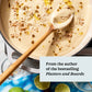 A creamy soup with grains and oil is stirred in a pot with a wooden spoon, offering just one example of the easy soup recipes featured in Every Season Is Soup Season by Chronicle Books. A text overlay reads, “From the author of the bestselling Platters and Boards.” Lime slices and a glass nearby hint at even more healthy recipes waiting to be discovered in this inspiring soup cookbook.
