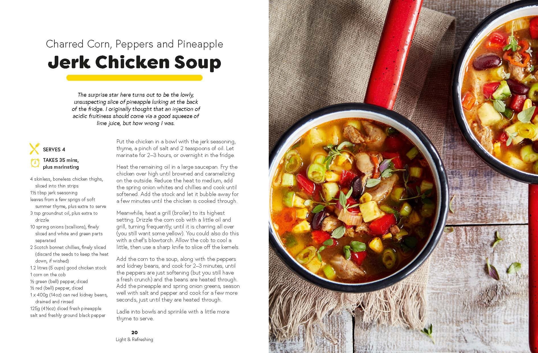 A saucepan filled with vibrant jerk chicken soup—a nourishing recipe from *Seriously Good Soups* by Chronicle Books—sits on a rustic table beside a cloth napkin, with the recipe text displayed on the left.