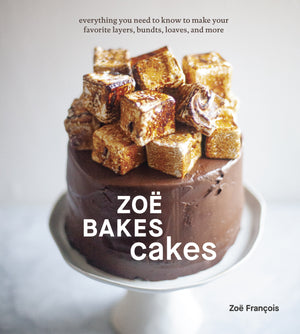 Chocolate frosted homemade cake with toasted marshmallow cubes on a white stand; text reads "Zoë Bakes Cakes" by Zoë François, from Penguin Random House, featuring irresistible baking recipes.