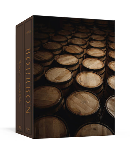 Discover the rich history of Kentucky whiskey with Bourbon, The Story of Kentucky Whiskey from Penguin Random House—a box set featuring expert guides and tips, beautifully presented with a cover image of rows of wooden bourbon barrels stacked in a dimly lit rickhouse, all inspired by the craft and tradition of Kentucky bourbon.