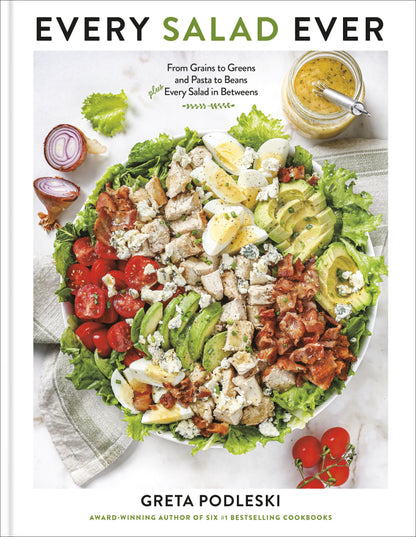 Sure! Here’s a rewritten version using your product data: The “Every Salad Ever” cookbook, published by Penguin Random House, features a vibrant cover with a hearty salad topped with chicken, bacon, avocado, tomatoes, lettuce, blue cheese, and dressing. Authored by Greta Podleski, this collection bursts with creative salad recipes—offering delectable vegan and gluten-free options to satisfy every palate.