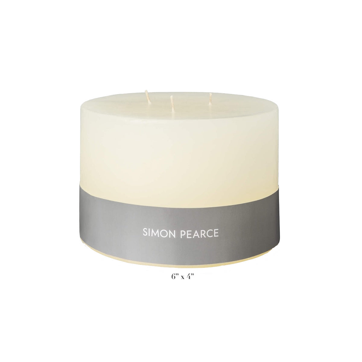 The Simon Pearce Ivory Candle Collection features a wide, white three-wick candle (6" diameter x 4" tall) that brings small-batch craftsmanship and warmth to your home.