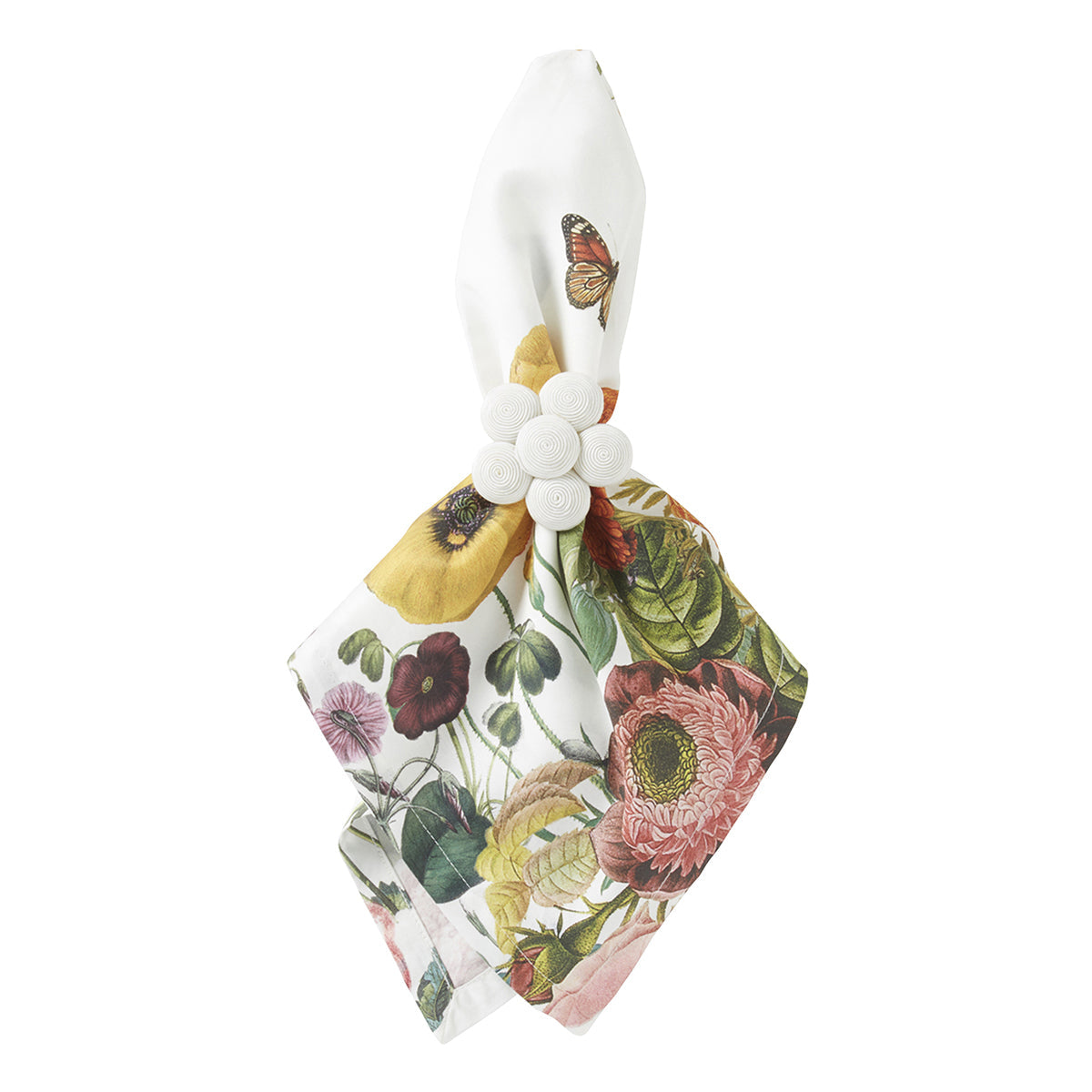 The Field of Flowers White Napkin Set by Juliska features elegant white linen napkins adorned with vibrant floral and butterfly prints, each elegantly secured with a white ring accented by a cluster of circular embellishments. Perfect for any occasion, these sophisticated napkins bring charm and bold style to your table setting.