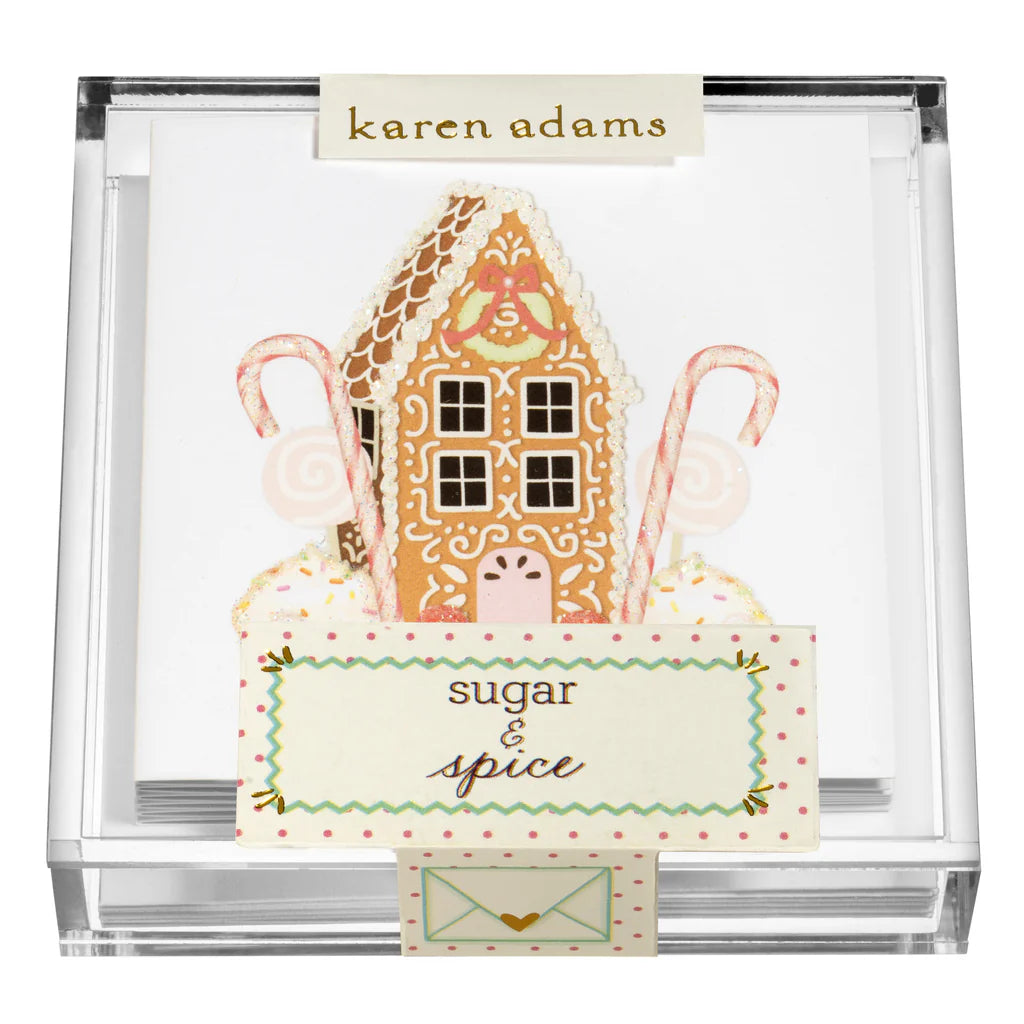 The Holiday Acrylic Gift Enclosures by Karen Adams feature notepaper with a gingerbread house, candy canes, and "sugar & spice" text in a clear acrylic box—perfect for holiday gifting.