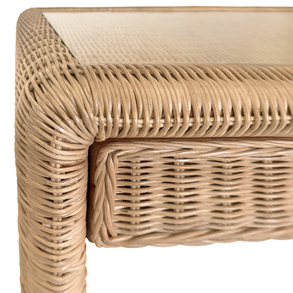 Close-up of the Adrien Desk by Worlds Away, featuring detailed woven rattan texture and a glass top in a light natural finish for an elegant workspace.