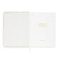 Sugar Paper’s Pale Pink Undated Weekly Planner features a striped inside cover and a title page embossed with “WEEKLY PLANNER” in gold lettering. A white ribbon bookmark keeps your place as you track habits and set goals each week.