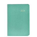 The Graphic Image 2026 Daily Journal Planner Collection features a green textured day-at-a-view planner with "2026" embossed in gold on the cover.