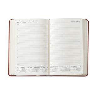 The 2026 Daily Journal Planner Collection by Graphic Image features a day-at-a-view layout with lined sections for appointments and notes, dated pages for July 15 and 16, plus a small yearly calendar at the bottom.
