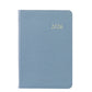 The Graphic Image 2026 Daily Journal Planner Collection features a blue textured diary with "2026" in gold on the cover, shown against a white background.