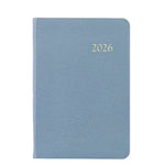 The Graphic Image 2026 Daily Journal Planner Collection features a blue textured diary with "2026" in gold on the cover, shown against a white background.