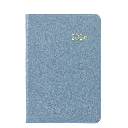 The Graphic Image 2026 Daily Journal Planner Collection features a blue textured diary with "2026" in gold on the cover, shown against a white background.