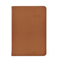 The Graphic Image 2026 Daily Journal Planner Collection features a brown leather-bound diary with "2026" embossed on the cover, designed for day-at-a-view scheduling and organized planning.