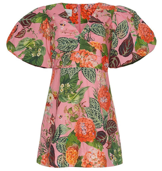 A Cara Cara Aliza Dress with bubble sleeves and a flared skirt, displaying a vibrant pattern of green leaves and orange blooms.