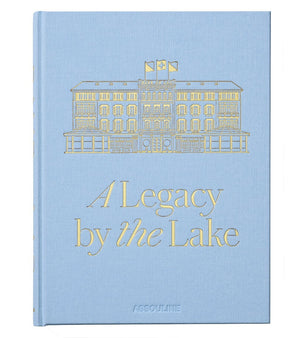 Featuring a light blue cover with a gold illustration of a building, Baur Au Lac: A Legacy by the Lake by Assouline celebrates the storied history of Zurich’s renowned luxury hotel, Baur au Lac.