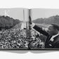 An open book from Assouline’s America: The Imagination of a Nation displays a striking black and white photograph of Martin Luther King Jr. waving to a vast crowd at the Lincoln Memorial, the Washington Monument silhouetted in the background—a powerful image commemorating America’s path toward equality as the nation approaches its 250th anniversary.