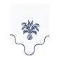 The Ananas Blue Napkin Set by Aquazzura Casa features Italian-made white linen napkins with blue trim, scalloped edges, and a center pineapple embroidery with palm-like leaves.