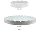 The Addison Ross Round Scalloped Lacquer Tray Collection features two white trays—8.5" and 20" in diameter—with scalloped edges and a high-gloss finish, bringing modern elegance to any space.