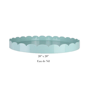The Addison Ross Round Scalloped Lacquer Tray Collection features a 20"x20" tray in pale blue-green Eau de Nil with a high gloss finish, adding an elegant touch to any setting.