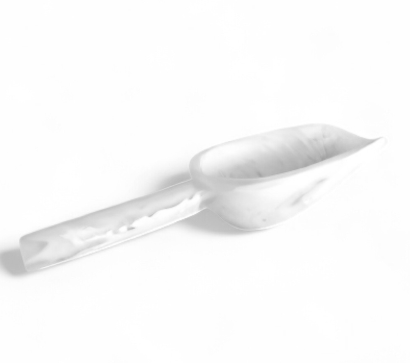 The Nashi Home White Swirl Resin Serveware Collection features a white plastic scoop with a flat handle, perfect for serving, shown against a plain white background.