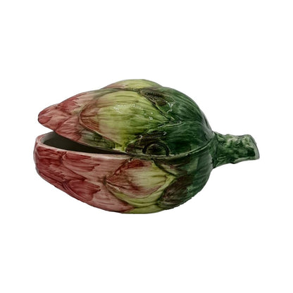 From Les Ottomans' Artichoke Decor and Serveware Collection, this hand-painted Italian ceramic dish features an artichoke shape with a hinged lid—an elegant and unique tableware accent.